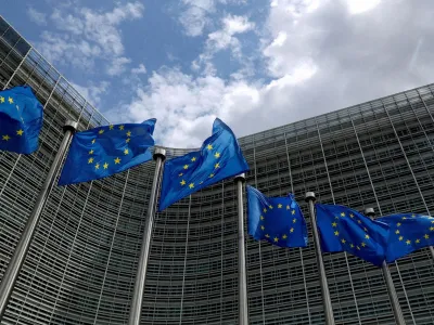 FILE PHOTO: European Union flags flutter outside the European Commission headquarters in Brussels, Belgium, June 5, 2020. REUTERS/Yves Herman/File Photo