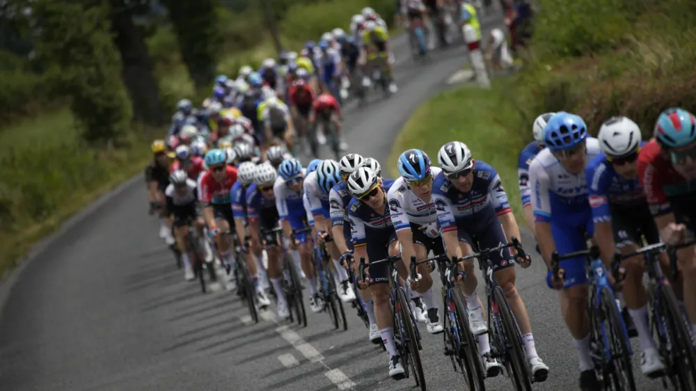 Netherlands' sprinter Fabio Jakobsen, in sixth position with white jersey, follows his teammates during the eleventh stage of the Tour de France cycling race over 180 kilometers (112 miles) with start in Clermont-Ferrand and finish in Moulins, France, Wednesday, July 12, 2023. (AP Photo/Daniel Cole)