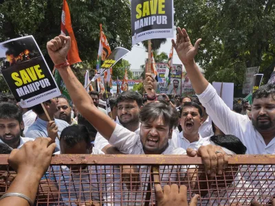 Members of the youth wing of India's Congress party shout slogans during a protest near Parliament House in New Delhi, India, Thursday, July 20, 2023. The protest was against deadly ethnic clashes in the country's northeast after a video showed two women being assaulted by a mob. The video triggered outrage across India and was widely shared on social media despite the internet being largely blocked in remote Manipur state. (AP Photo/Manish Swarup)