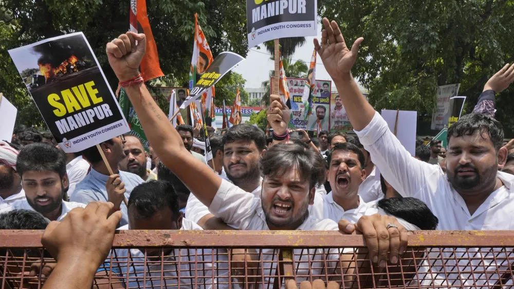 Members of the youth wing of India's Congress party shout slogans during a protest near Parliament House in New Delhi, India, Thursday, July 20, 2023. The protest was against deadly ethnic clashes in the country's northeast after a video showed two women being assaulted by a mob. The video triggered outrage across India and was widely shared on social media despite the internet being largely blocked in remote Manipur state. (AP Photo/Manish Swarup)