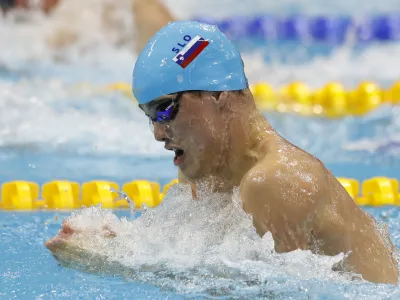 ﻿Slovenia's Peter John Stevens competes in a men's 50-meter breaststroke semifinal during the European Swimming Championships at the London Aquatics Centre in London, Friday, May 20, 2016. (AP Photo/Matt Dunham)