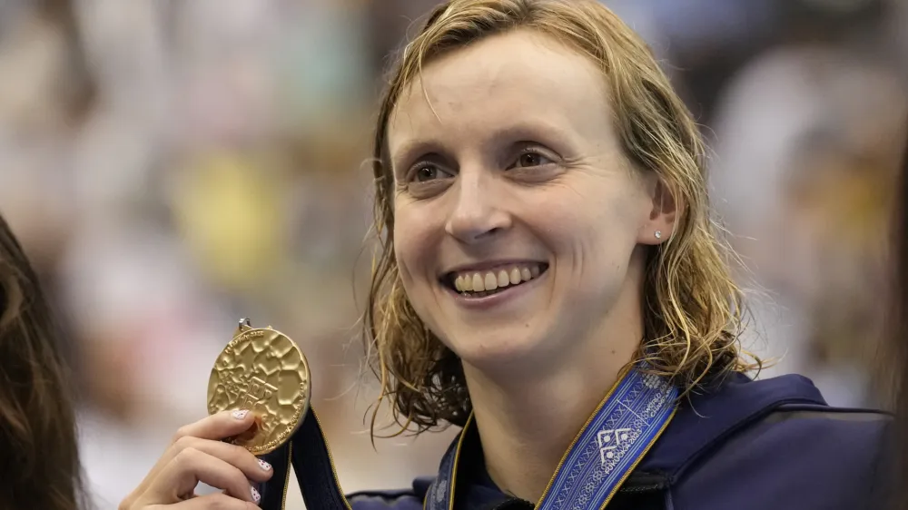 Gold medalist Katie Ledecky of United States holds her medal during ceremonies at women's 1500m freestyle finals at the World Swimming Championships in Fukuoka, Japan, Tuesday, July 25, 2023. (AP Photo/Lee Jin-man)