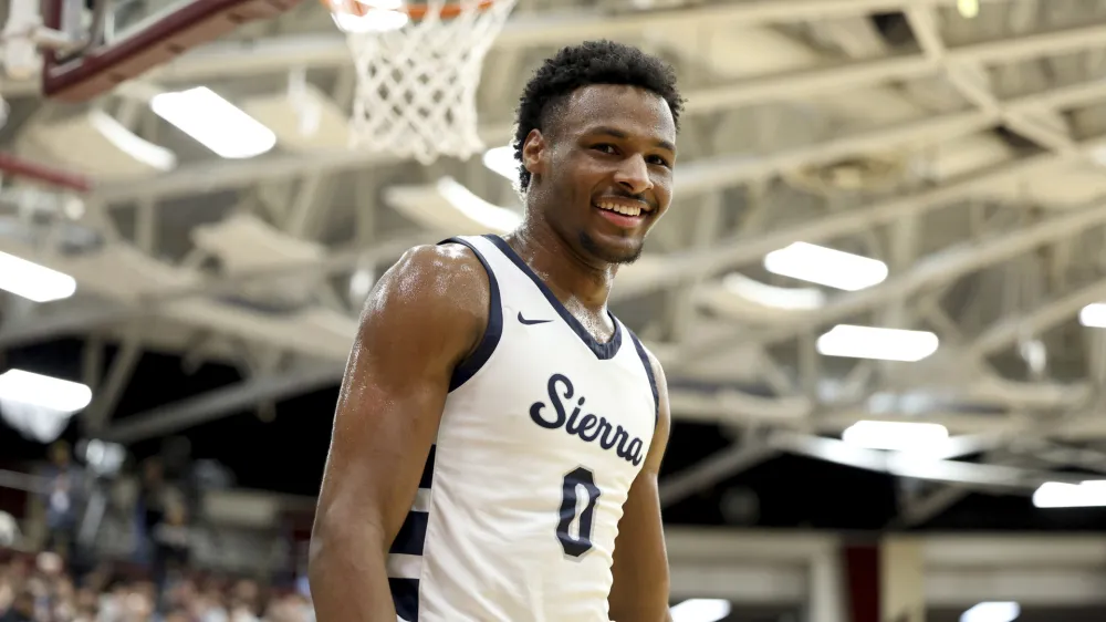 FILE - Sierra Canyon's Bronny James (0) smiles during a high school basketball game against Christopher Columbus at the Hoophall Classic, Monday, Jan. 16, 2023, in Springfield, Mass. Bronny James, son of NBA superstar LeBron James, was hospitalized after going into cardiac arrest while participating in a practice at Southern California on Monday, July 24, 2023. (AP Photo/Gregory Payan, File)