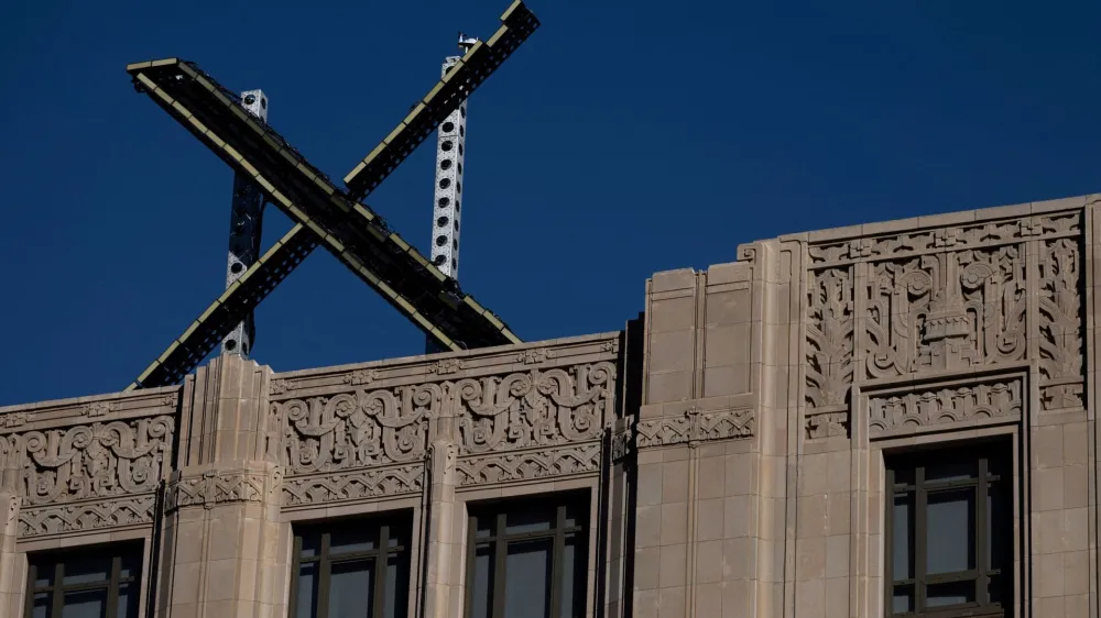 FILE PHOTO: 'X' logo is seen on the top of the headquarters of the messaging platform X, formerly known as Twitter, in downtown San Francisco, California, U.S., July 30, 2023. REUTERS/Carlos Barria/File Photo