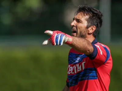 FILED - 21 July 2021, Italy, Brixen: Parma's goalkeeper Gianluigi Buffon gives instructions to his team-mates during the pre-season friendly soccer match between VfL Bochum and FC Parma. The long-time Italian world-class goalkeeper Gianluigi Buffon is about to end his career, according to several media reports. Photo: Tim Rehbein/dpa