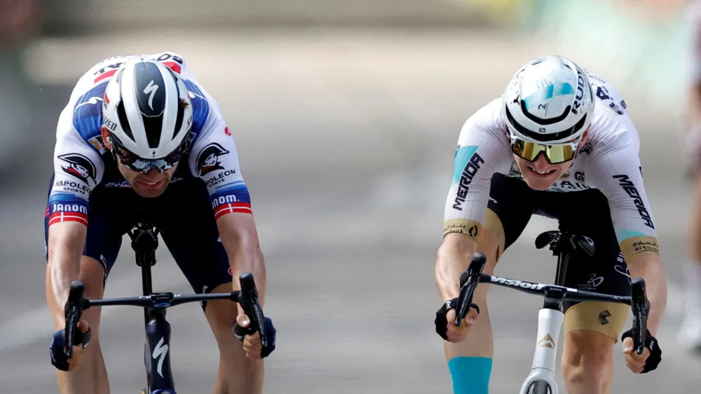 Cycling - Tour de France - Stage 19 - Moirans-En-Montagne to Poligny - France - July 21, 2023 Team Bahrain Victorious' Matej Mohoric crosses the finish line to win stage 19 alongside second placed Soudal–Quick-Step's Kasper Asgreen REUTERS/Stephane Mahe   TPX IMAGES OF THE DAY