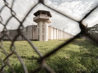 ﻿Prison with iron fences.Prison or jail is a building where people are forced to live if their freedom has been taken away.Prison is the building use for punishment prisoner.