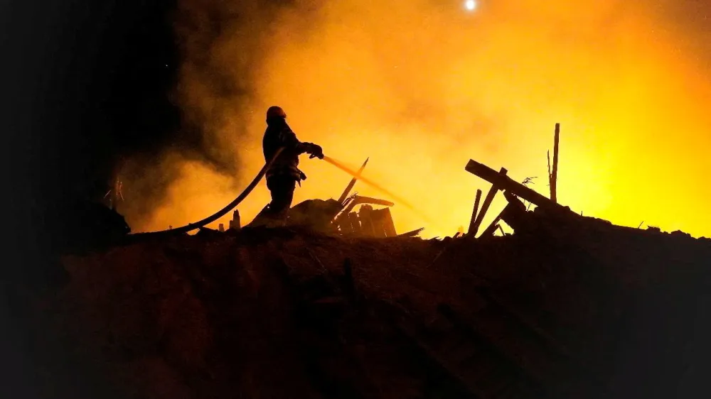 A firefighter extinguishes a fire in the aftermath of an attack, amid Russia's attack on Ukraine, given as Starokostiantyniv, Khmelnytskyi Region, Ukraine, in this handout photo released on August 6, 2023, courtesy of the Khmelnytskyi region administration/Handout via REUTERS THIS IMAGE HAS BEEN SUPPLIED BY A THIRD PARTY MANDATORY CREDIT   TPX IMAGES OF THE DAY