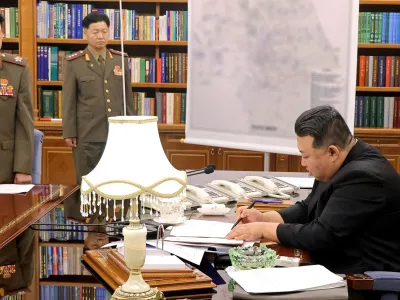 10 August 2023, North Korea, Pyongyang: An image provided by North Korea's state news agency KCNA on 10 August 2023 shows Supreme Leader of North Korea Kim Jong Un (R) chairs a meeting of the Workers' Party's Central Military Commission at the party's headquarters in Pyongyang. Photo: -/YNA/dpa