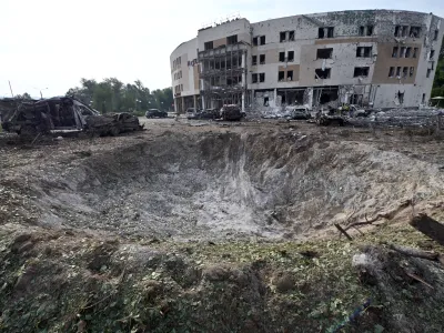 11 August 2023, Ukraine, Zaporizhzhia: The crater from a Russian missile attack is seen outside a hotel in Zaporizhzhia. Photo: -/Ukrinform/dpa