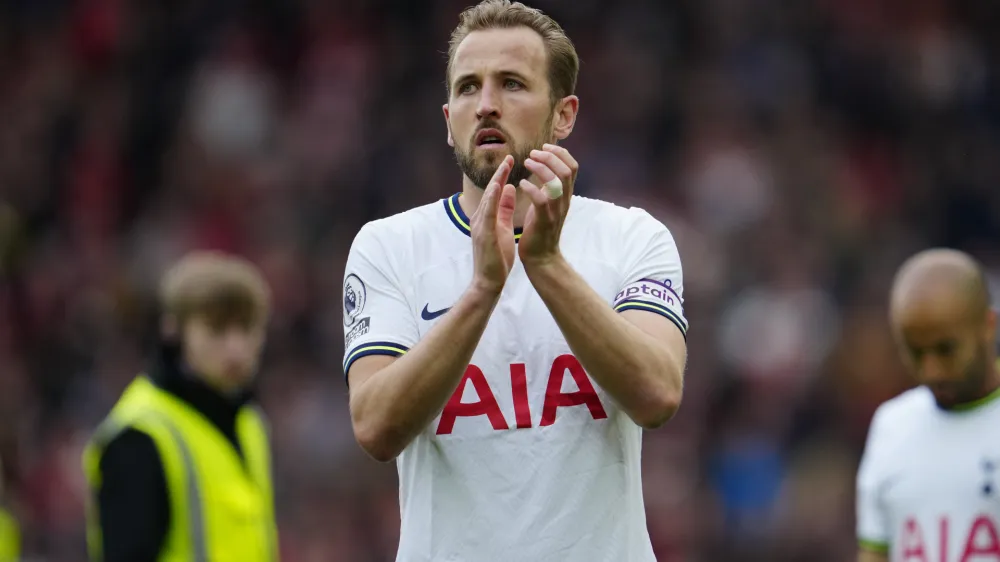 FILE - Tottenham's Harry Kane applauds fans after his team lost 4-3 at the end of an English Premier League soccer match between Liverpool and Tottenham Hotspur at Anfield stadium in Liverpool, Sunday, April 30, 2023. Bayern Munich coach Thomas Tuchel said Friday, Aug. 11, 2023, the club is still "working hard" to sign England captain Harry Kane after reports of delays in his expected transfer from Tottenham. (AP Photo/Jon Super, File)