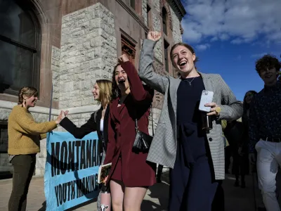 FILE - Youth plaintiffs in the climate change lawsuit, Held vs. Montana, arrive at the Lewis and Clark County Courthouse, on June 20, 2023, in Helena, Mont., for the final day of the trial. A Montana judge on Monday, Aug. 14, sided with young environmental activists who said state agencies were violating their constitutional right to a clean and healthful environment by permitting fossil fuel development without considering its effect on the climate. (Thom Bridge/Independent Record via AP, File)