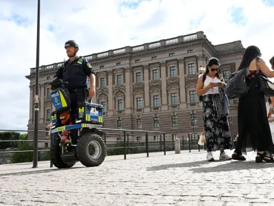 A police officer on a Segway patrols Sweden's parliament Riksdagen as the terror threat level in Sweden is raised to four on a five-point scale, in Stockholm, Sweden, August 17, 2023. Fredrik Sandberg/TT News Agency/via REUTERS   ATTENTION EDITORS - THIS IMAGE WAS PROVIDED BY A THIRD PARTY. SWEDEN OUT. NO COMMERCIAL OR EDITORIAL SALES IN SWEDEN.