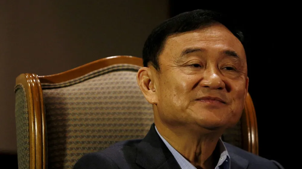 FILE PHOTO: Former Thai Prime Minister Thaksin Shinawatra looks on as he speaks to Reuters during an interview in Singapore February 23, 2016. REUTERS/Edgar Su/File Photo/File Photo