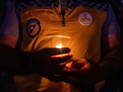 20 August 2023, Syria, Idlib: A member of the Syria Civil Defence, known as White Helmets participates in a commemoration event for the 10th anniversary of the Ghouta chemical attack. Photo: Anas Alkharboutli/dpa