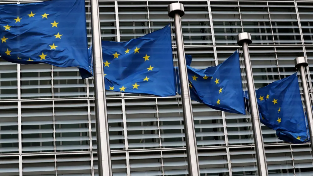 FILE PHOTO: European Union flags fly outside the European Commission headquarters in Brussels, Belgium, March 6, 2019. REUTERS/Yves Herman/File Photo/File Photo