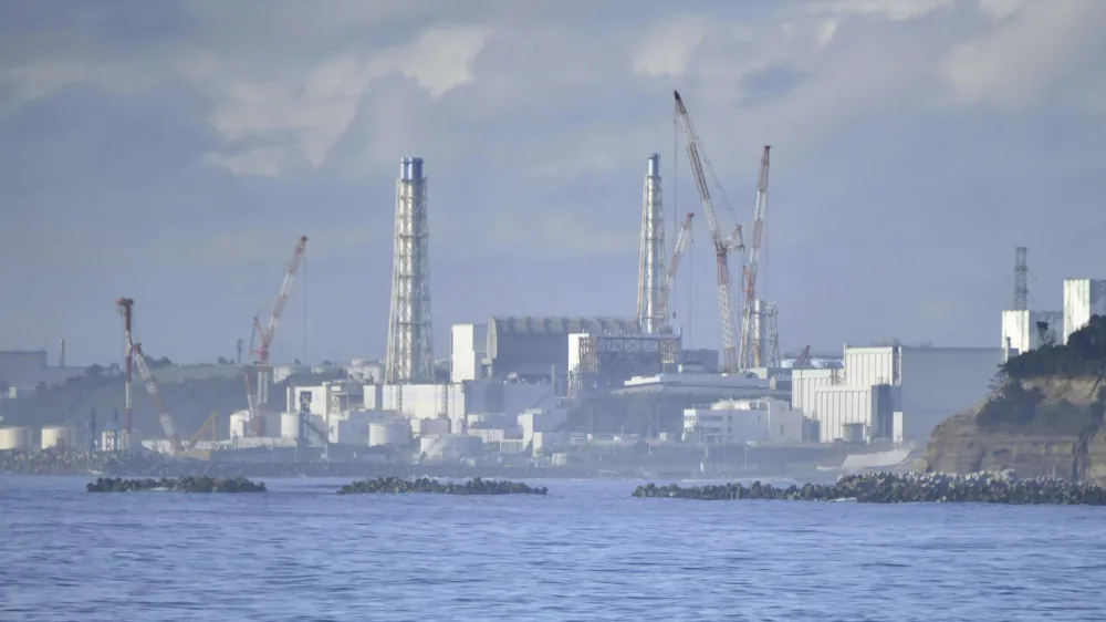 Fukushima Daiichi nuclear plant is seen from Namie, Fukushima prefecture, Japan Tuesday, Aug. 22, 2023. Japan will start releasing treated and diluted radioactive wastewater from the Fukushima Daiichi nuclear plant into the Pacific Ocean as early as Thursday, a controversial but essential early step in the decades of work to shut down the facility 12 years after its meltdown disaster. (Kyodo News via AP)