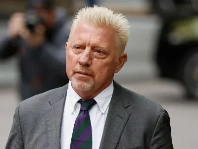 Former tennis player Boris Becker arrives with his partner Lilian de Carvalho Monteiro (not pictured) at Southwark Crown Court to face sentencing after being found guilty of four charges earlier this month, in London, Britain, April 29, 2022. REUTERS/John Sibley