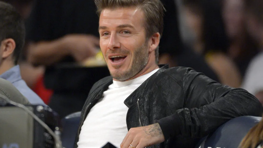 Soccer player David Beckham watches the Los Angeles Lakers play the Orlando Magic NBA basketball game, Sunday, Dec. 2, 2012, in Los Angeles. The Magic won 113-103. (AP Photo/Mark J. Terrill) 