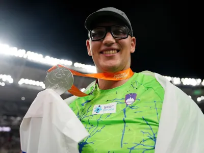 Athletics - World Athletics Championship - Men's Discus Throw Final - National Athletics Centre, Budapest, Hungary - August 21, 2023 Slovenia's Kristjan Ceh celebrates after winning silver REUTERS/Aleksandra Szmigiel