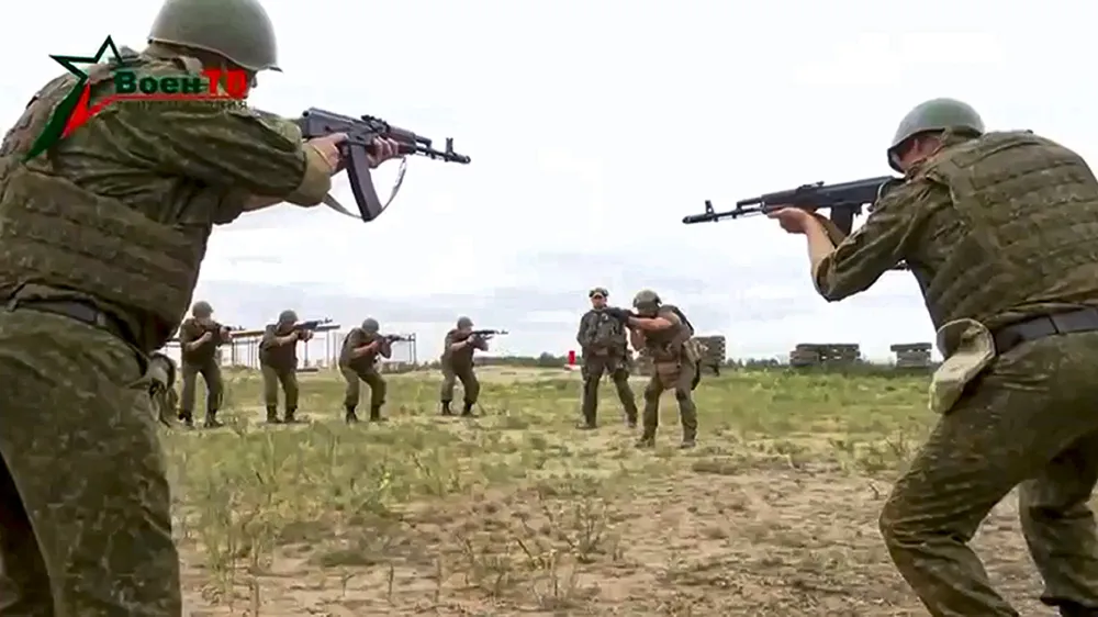 FILE - In this image from video provided by the Belarusian Defense Ministry via VoenTV on Friday, July 14, 2023, Belarusian soldiers attend a training by mercenary fighters from Wagner private military company near Tsel village, about 90 kilometers (about 55 miles) southeast of Minsk, Belarus. After Yevgeny Prigozhin's daylong mutiny against Russia's military leadership, the Kremlin cut a deal for him to move to Belarus. A camp for his fighters was erected there, and they trained together with the Belarusian military. Prigozhin in the meantime moved freely between Belarus, Russia and apparently Africa. (Belarusian Defense Ministry via VoenTV via AP, File)