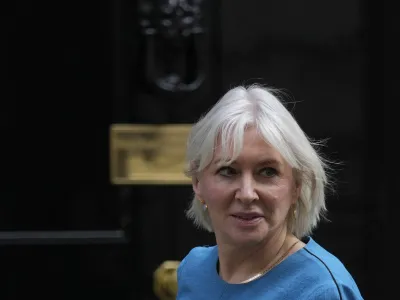 FILE - Britain's Secretary of State for Digital, Culture, Media Nadine Dorries leaves 10 Downing Street following a cabinet meeting where the cabinet were given details of the Spring Statement by the Rishi Sunak Chancellor of the Exchequer in London, on March 23, 2022. British Conservative lawmaker Nadine Dorries finally stepped down from Parliament on Saturday Aug. 26, 2023, more than two months after announcing she was quitting in the wake of former Prime Minister Boris Johnson's resignation from Parliament. (AP Photo/Alastair Grant, File)