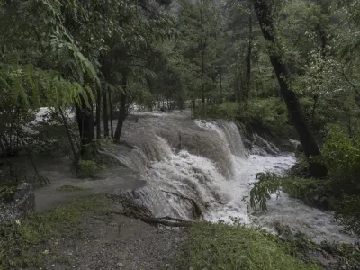 The Brenno river overflows after heavy rainfalls in Malvaglia, Switzerland, Monday, Aug. 28, 2023. The canton Tessin, the Italian part of Switzerland, got a lot of rain since Friday night. According to forecasts, the rains will continue until Monday. (Pablo Gianinazzi/Keystone via AP)