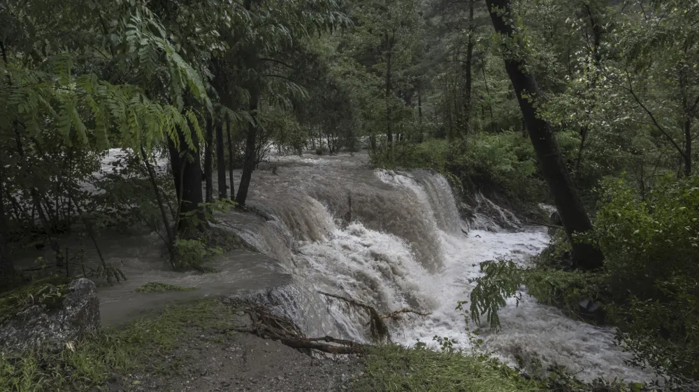 The Brenno river overflows after heavy rainfalls in Malvaglia, Switzerland, Monday, Aug. 28, 2023. The canton Tessin, the Italian part of Switzerland, got a lot of rain since Friday night. According to forecasts, the rains will continue until Monday. (Pablo Gianinazzi/Keystone via AP)