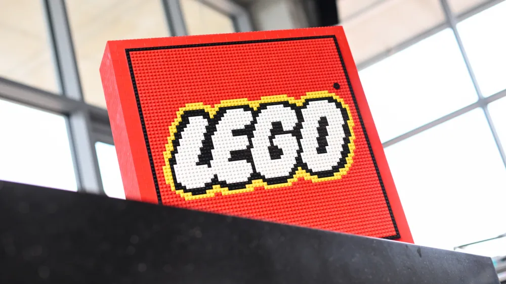 FILED - 25 May 2022, Bavaria, Munich: A general view of the Lego company logo built from bricks at the Lego Summer Birthday Bash anniversary event. Danish toymaker Lego has reported high profits for the first half of 2023, following on from a record year in 2022. Photo: Tobias Hase/dpa