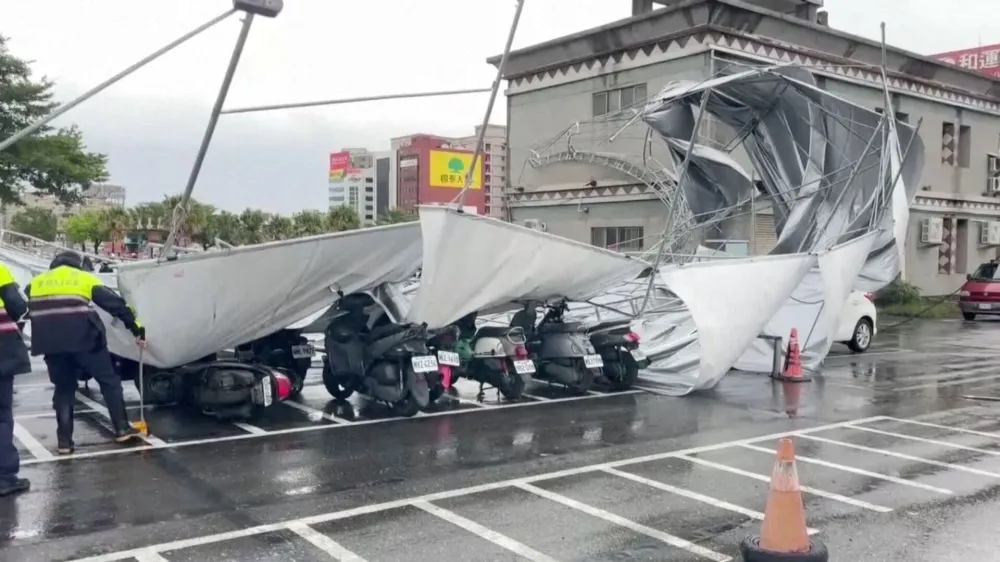 A collapsed canopy is seen at a parking lot as Typhoon Haikui approaches, in Hualien, Taiwan September 3, 2023, in this screengrab taken from a video provided by CTI. CTI via REUTERS THIS IMAGE HAS BEEN SUPPLIED BY A THIRD PARTY. NO RESALES. NO ARCHIVES. MANDATORY CREDIT. TAIWAN OUT. NO COMMERCIAL OR EDITORIAL SALES IN TAIWAN