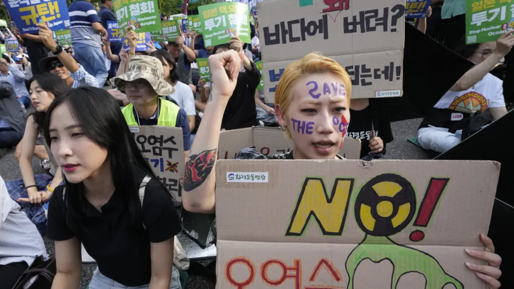 A protester shouts slogans during a rally to demand the stop of the Japan's release of treated radioactive water from the damaged Fukushima nuclear power plant into the sea and denounce the South Korean government's policy in Seoul, South Korea, Saturday, Sept. 2, 2023. (AP Photo/Ahn Young-joon)