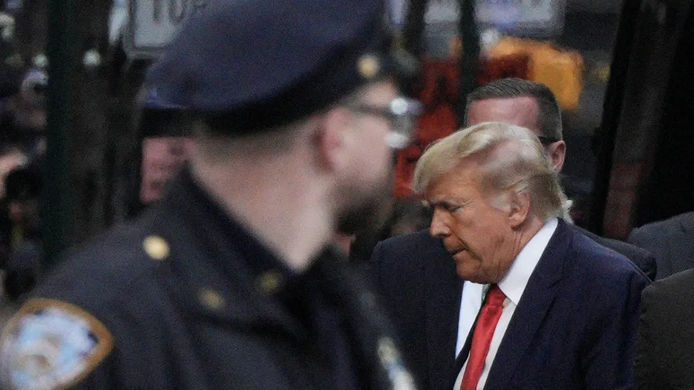 Former U.S. President Donald Trump arrives at Trump Tower, after his indictment by a Manhattan grand jury following a probe into hush money paid to porn star Stormy Daniels, in New York City, U.S April 3, 2023. REUTERS/Jeenah Moon