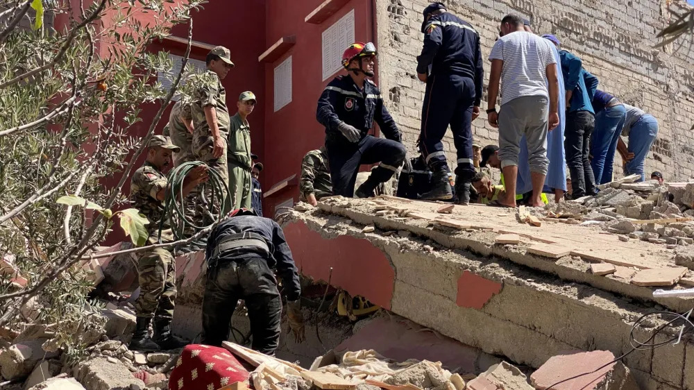 Rescuers carry a search operation following a powerful earthquake, in Amizmiz, in Morocco, September 9, 2023. REUTERS/Abdelhak Balhaki