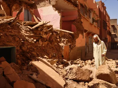 Mohamed Sebbagh, 66, stands in front of his destroyed house, in the aftermath of a deadly earthquake, in Amizmiz, Morocco, September 10, 2023. REUTERS/Nacho Doce