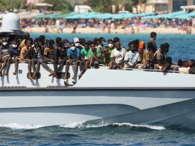 Migrants arrive on an Italian Coast Guard vessel after being rescued at sea, on the Sicilian island of Lampedusa, Italy, September 15, 2023. REUTERS/Yara Nardi