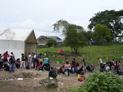 Migrants trying to reach the United States gather on a makeshift camp in Lajas Blancas, Darien province, Panama, Saturday, Sept. 23, 2023. (AP Photo/Arnulfo Franco)