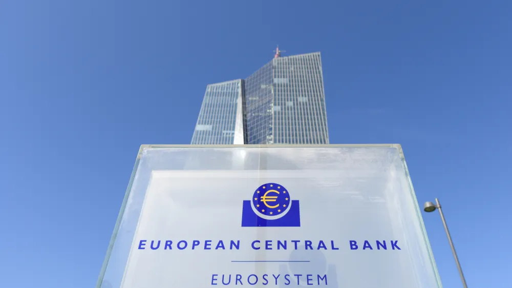 FILED - 07 September 2016, Hessen, Frankfurt/Main: The headquarters of the European Central Bank (ECB) in Frankfurt am Main (Hesse) protrudes from behind a stele with the ECB logo. Banks in the eurozone need to prepare better in view of the looming financial risks of climate change, warned the European Central Bank (ECB) on Friday. Photo: Arne Dedert/dpa