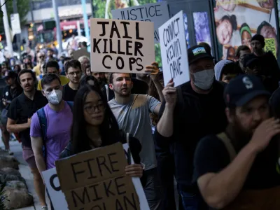 FILE - Protesters march through downtown Seattle after body camera footage was released of a Seattle police officer joking about the death of Jaahnavi Kandula, a 23-year-old woman hit and killed in January by officer Kevin Dave in a police cruiser, Sept. 14, 2023, in Seattle. A Seattle police officer and union leader under investigation for laughing and making callous remarks about the death of Kandula, from India, who was struck by a police SUV, has been taken off patrol duty, police said Thursday, Sept. 28. (AP Photo/Lindsey Wasson, File)