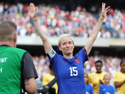 Sep 24, 2023; Chicago, Illinois, USA; United States forward Megan Rapinoe (15) reacts after a ceremony honoring her career on the national team before the game against South Africa at Soldier Field. Mandatory Credit: Jon Durr-USA TODAY Sports