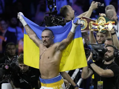 FILE - Ukraine's Oleksandr Usyk celebrates after beating Britain's Anthony Joshua to retain his world heavyweight title at King Abdullah Sports City in Jeddah, Saudi Arabia, on Aug. 21, 2022. Tyson Fury will face Oleksandr Usyk in Saudi Arabia in the first fight this century to unify all of the four major heavyweight boxing titles, Fury's promoter Frank Warren said Friday, Sept. 29, 2023. (AP Photo/Hassan Ammar, File)