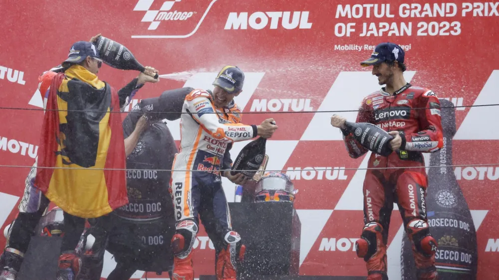 MotoGP - Japanese Grand Prix - Mobility Resort Motegi, Motegi, Japan - October 1, 2023 Prima Pramac Racing's Jorge Martin celebrates on the podium after winning the MotoGP, along with second placed Ducati Lenovo Team's Francesco Bagnaia and third placed Repsol Honda Team's Marc Marquez REUTERS/Issei Kato