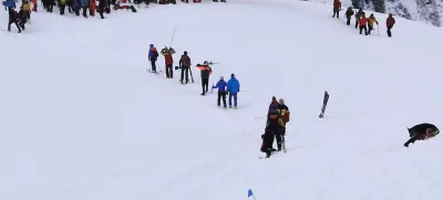 Rescue workers are seen at the site where two avalanches came down a mountainside in the Diemtig valley in the Bernese Oberland January 3, 2010. After a rescue team arrived on the scene, a second avalanche caught an unknown number of people involved in the search for a trapped skier on Sunday. The police said at least three other people are missing and believed to be buried under the snow from avalanches that killed three ski mountaineers and a doctor involved in the search and rescue operation after the first avalanche. Picture taken January 3, 2010. REUTERS/ Police of the canton Bern/Handout (SWITZERLAND - Tags: DISASTER ENVIRONMENT IMAGES OF THE DAY)