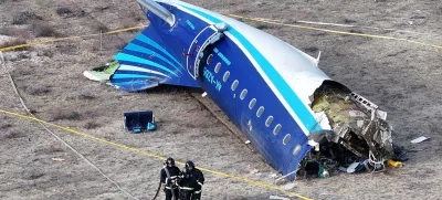 FILE PHOTO: A drone view shows emergency specialists working at the crash site of an Azerbaijan Airlines passenger plane near the city of Aktau, Kazakhstan December 25, 2024. REUTERS/Azamat Sarsenbayev/File Photo