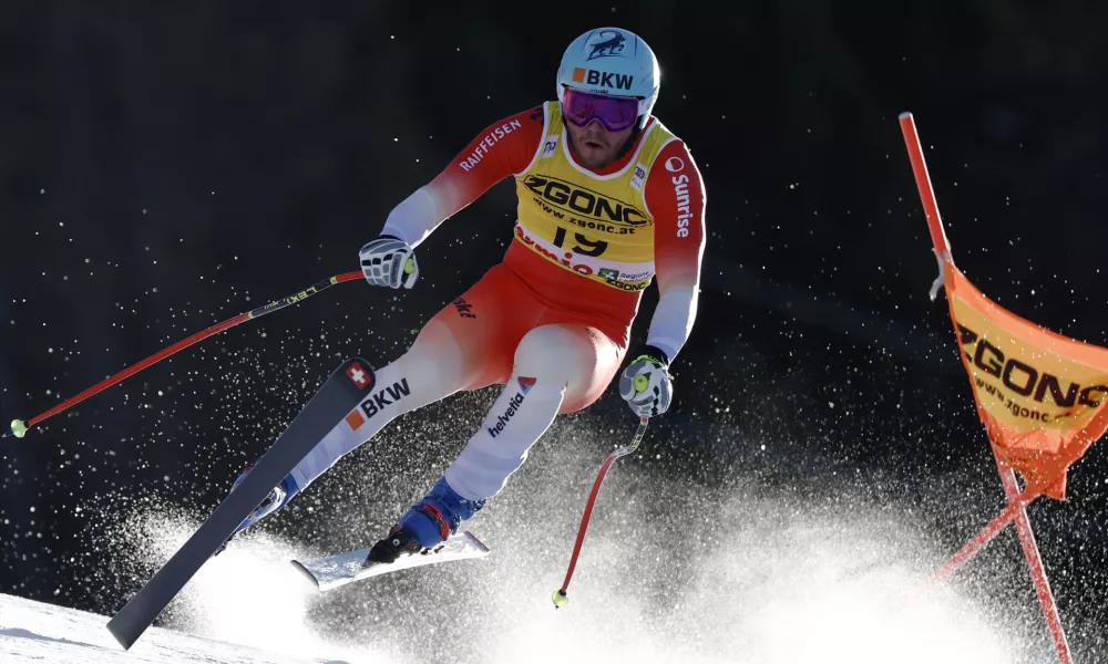 Switzerland's Alexis Monney speeds down the course during an alpine ski, men's World Cup downhill race, in Bormio, Italy, Saturday, Dec. 28, 2024. (AP Photo/Gabriele Facciotti)