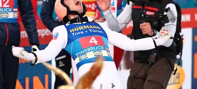 04 January 2025, Austria, Innsbruck: Austria's Stefan Kraft (R) celebrates victory after the men's Large Hill Tournament at the FIS Ski Jumping World Cup. Photo: Daniel Karmann/dpa