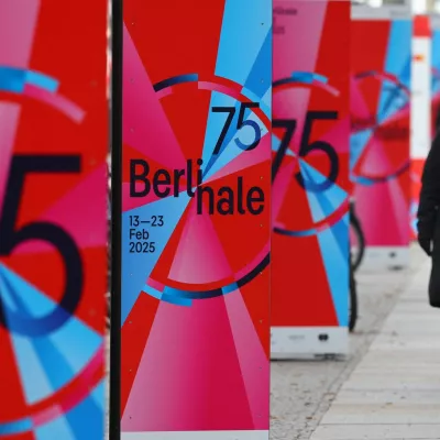 A pedestrian walks past advertising posters for the upcoming 75th Berlinale International Film Festival in Berlin, Germany February 12, 2025. REUTERS/Fabrizio Bensch