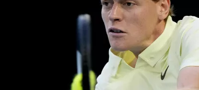 FILE -Jannik Sinner of Italy plays a backhand return to Alexander Zverev of Germany during the men's singles final at the Australian Open tennis championship in Melbourne, Australia, Jan. 26, 2025. (AP Photo/Asanka Brendon Ratnayake, File)