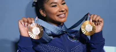 FILE - Jordan Chiles, of the United States, holds up her medals after the women's artistic gymnastics individual apparatus finals Bercy Arena at the 2024 Summer Olympics, Aug. 5, 2024, in Paris, France. (AP Photo/Charlie Riedel, File)