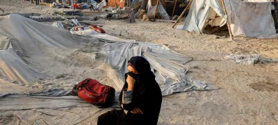 FILE PHOTO: A Palestinian woman reacts at the site following Israeli strikes on a tent camp sheltering displaced people, amid the Israel-Hamas conflict, at the Al-Mawasi area in Khan Younis, in the southern Gaza Strip, September 10, 2024. REUTERS/Mohammed Salem/File Photo