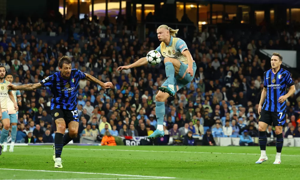 Soccer Football - Champions League - Manchester City v Inter Milan - Etihad Stadium, Manchester, Britain - September 18, 2024 Manchester City's Erling Haaland in action with Inter Milan's Francesco Acerbi REUTERS/Molly Darlington